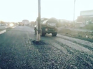 В ВКО дорожным рабочим при укладке асфальта на проезжей части помешал столб